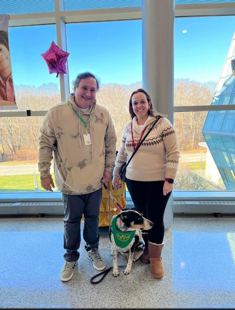 Carlos Moriella, a woman and Mia at National Adoption Day in Rhode Island